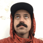 Man in an orange rain jacket